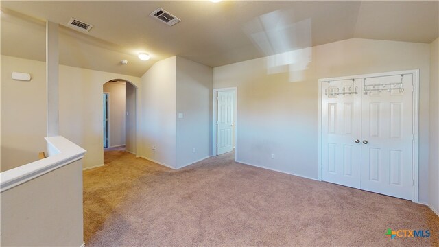 1906 Terry Dr, Copperas Cove, TX 76522 - unfurnished room featuring arched walkways, vaulted ceiling, carpet, and baseboards