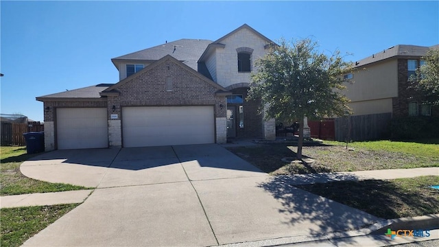 1906 Terry Dr, Copperas Cove, TX 76522 - french country home featuring brick siding, an attached garage, and driveway