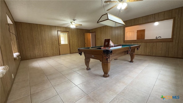 recreation room featuring light tile patterned floors, ceiling fan, a textured ceiling, and pool table