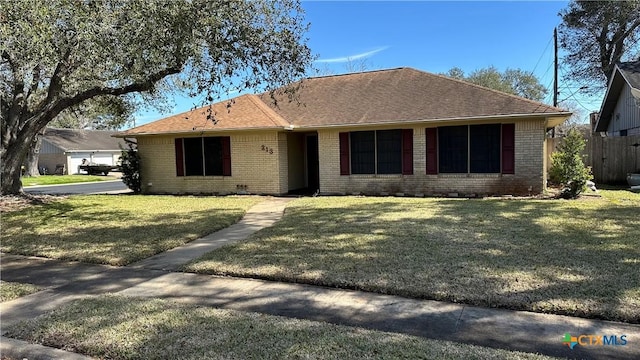 ranch-style home with brick siding, crawl space, a front yard, and a shingled roof