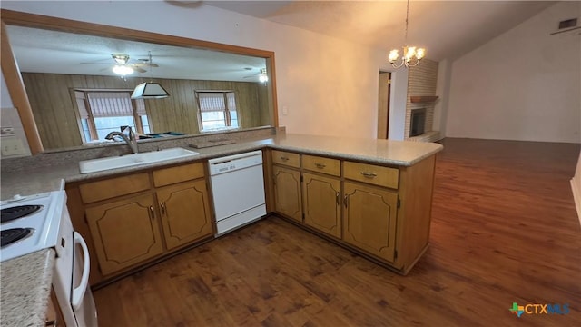 kitchen featuring a fireplace, dark wood-type flooring, a sink, white appliances, and ceiling fan with notable chandelier