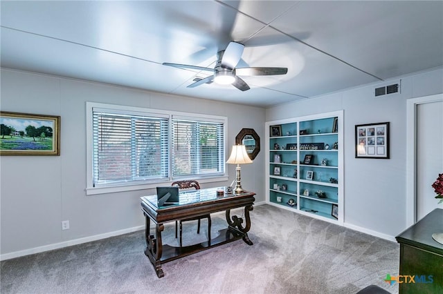 2518 Marlandwood Rd, Temple, TX 76502 - home office featuring baseboards, carpet flooring, a ceiling fan, visible vents, and built in shelves