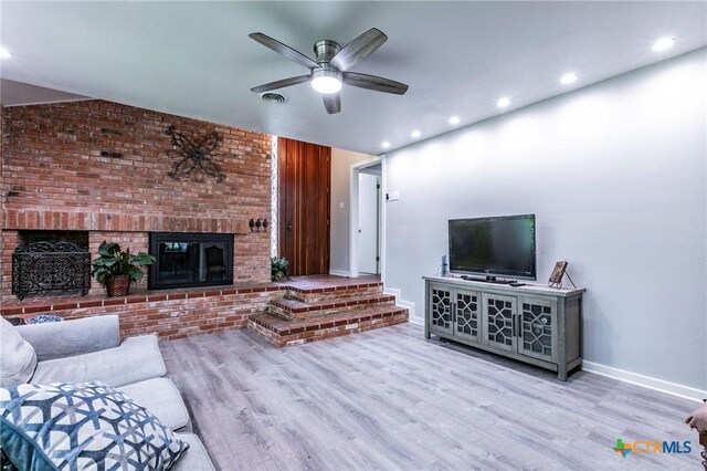2518 Marlandwood Rd, Temple, TX 76502 - living room with wood finished floors, ceiling fan, a fireplace, and baseboards