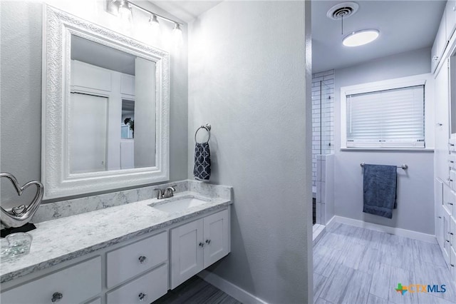 2518 Marlandwood Rd, Temple, TX 76502 - full bath with vanity, visible vents, and baseboards