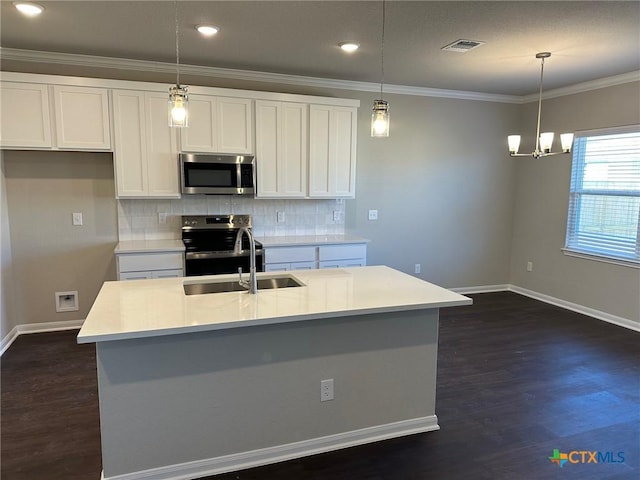 kitchen featuring appliances with stainless steel finishes, dark wood-style flooring, visible vents, and a sink