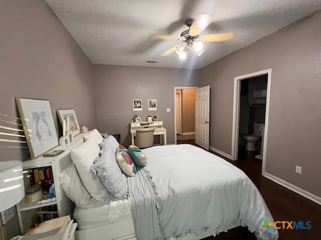 2800 S 3- A St, Waco, TX 76706 - bedroom featuring dark wood-style flooring, baseboards, and ceiling fan