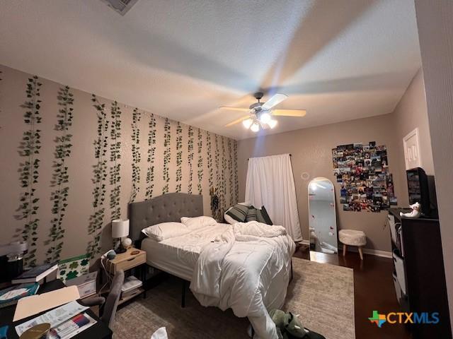 2800 S 3- A St, Waco, TX 76706 - bedroom featuring baseboards, ceiling fan, and dark wood finished floors