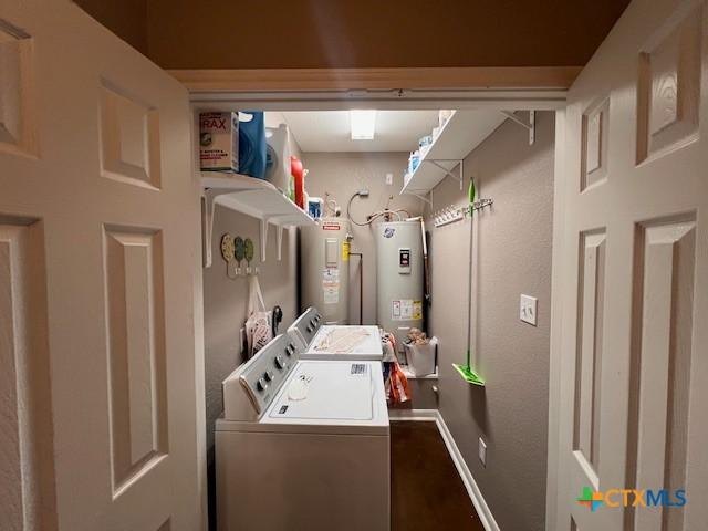 2800 S 3- A St, Waco, TX 76706 - laundry room featuring washer and clothes dryer, water heater, electric water heater, and baseboards