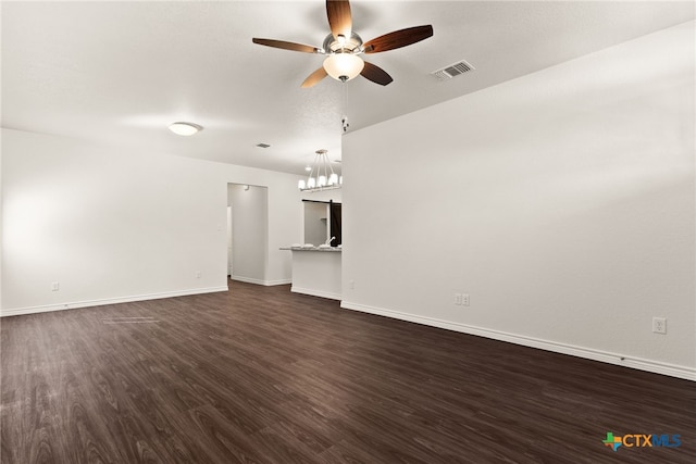 unfurnished living room with visible vents, baseboards, a ceiling fan, and dark wood-style flooring