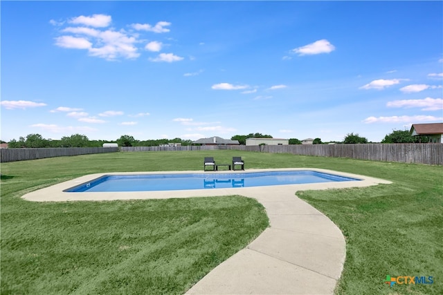 view of pool with a lawn