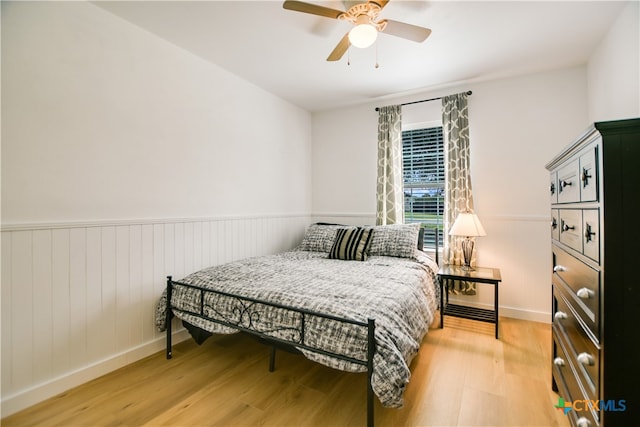 bedroom featuring ceiling fan and light hardwood / wood-style floors