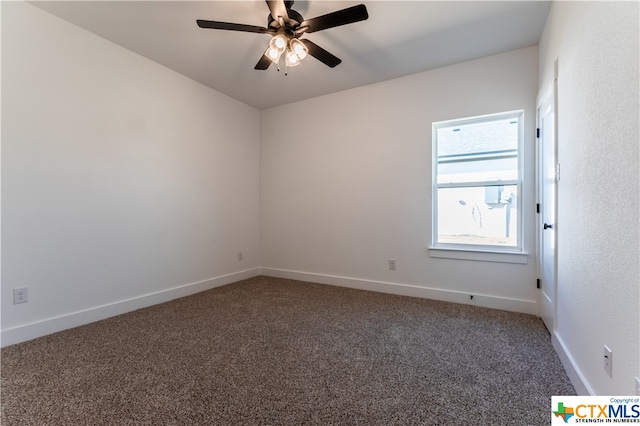 carpeted spare room with ceiling fan