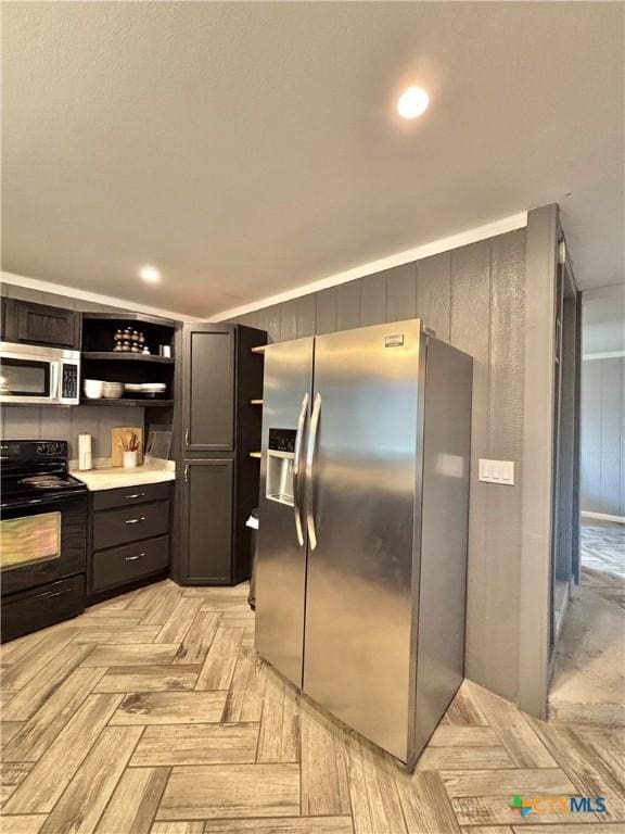 kitchen featuring light parquet floors and stainless steel appliances