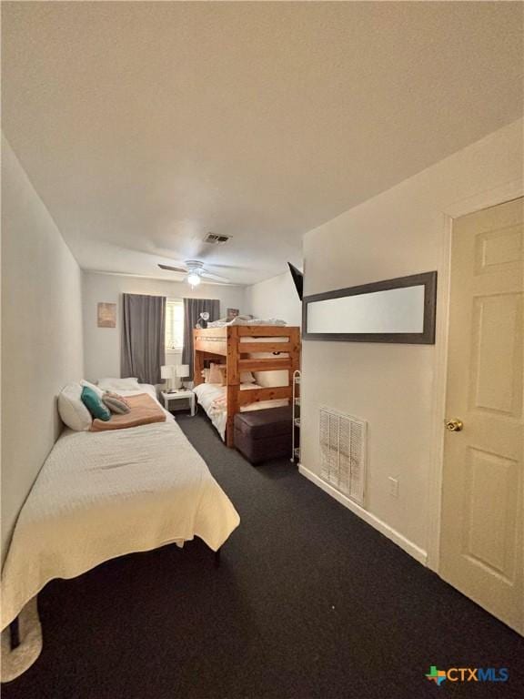 bedroom with ceiling fan and carpet floors