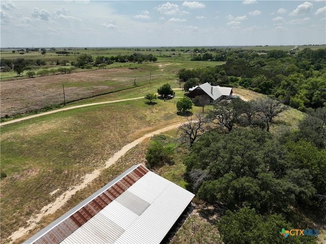 birds eye view of property with a rural view