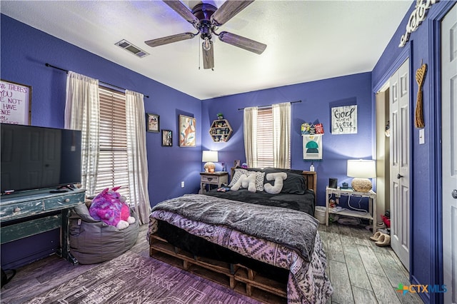 bedroom featuring ceiling fan and wood-type flooring