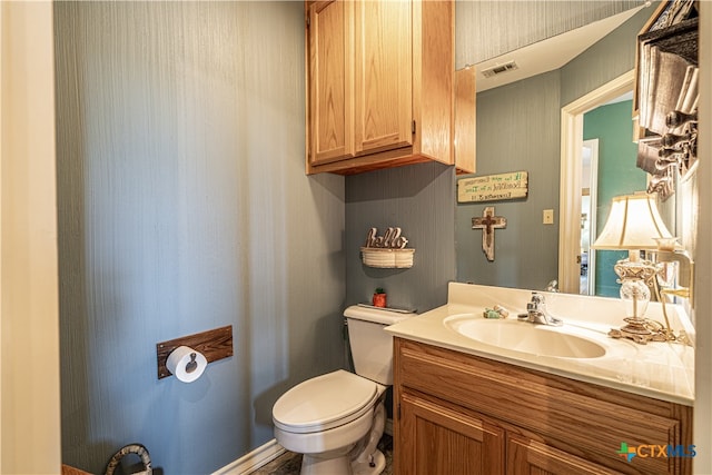 bathroom with vanity and toilet