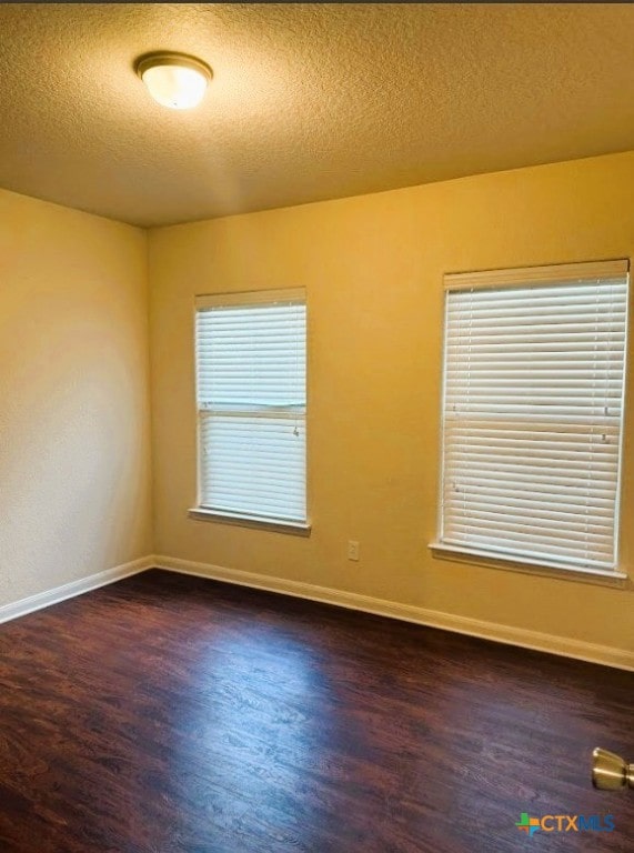 2421 Hornsby, Spring Branch, TX 78070 - empty room featuring wood finished floors and a textured ceiling