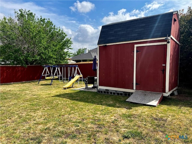 2005 Stonehenge Dr, Harker Heights, TX 76548 - view of shed with a playground and a fenced backyard