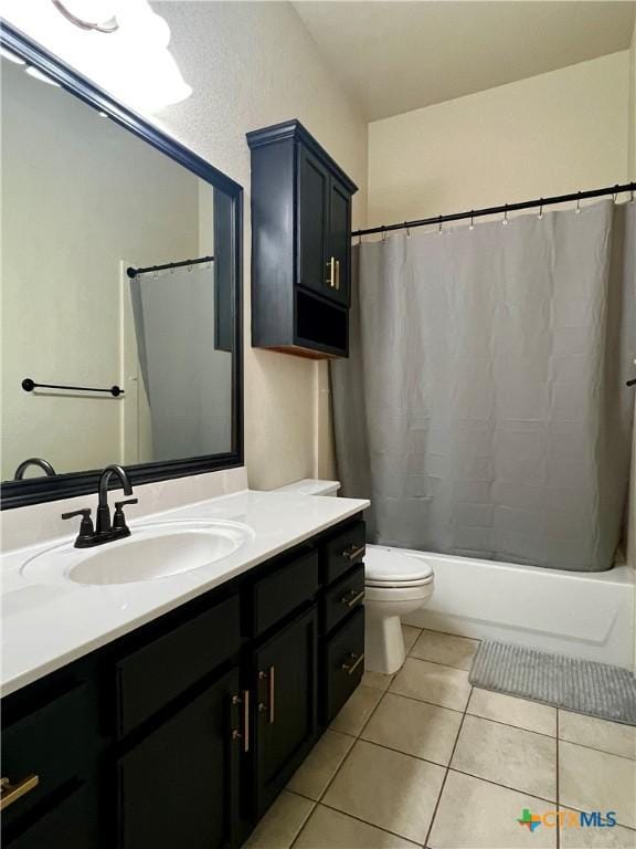 2005 Stonehenge Dr, Harker Heights, TX 76548 - full bath with vanity, tile patterned floors, and shower / tub combo with curtain