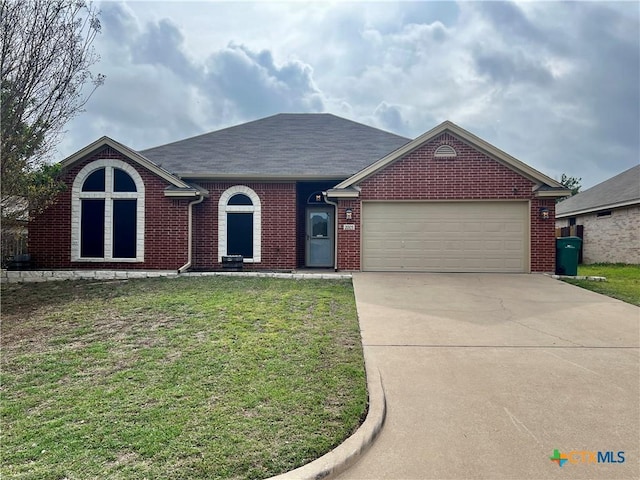 2005 Stonehenge Dr, Harker Heights, TX 76548 - single story home with an attached garage, driveway, a front lawn, brick siding, and a shingled roof