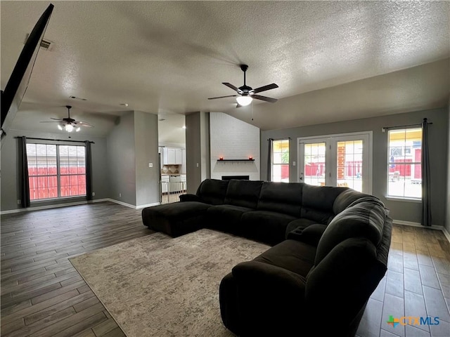 2005 Stonehenge Dr, Harker Heights, TX 76548 - living room with ceiling fan, a textured ceiling, lofted ceiling, and wood finished floors