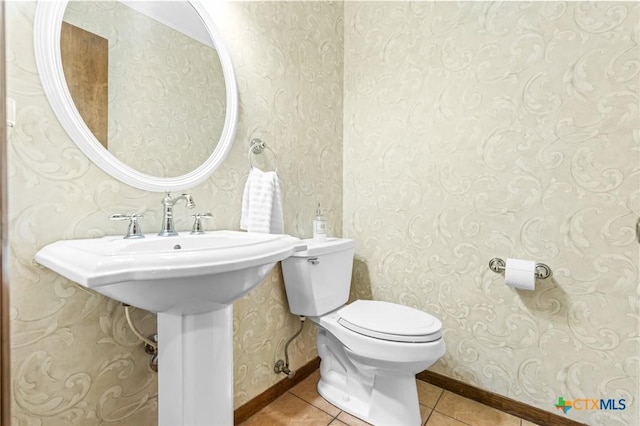 bathroom with tile patterned flooring and toilet