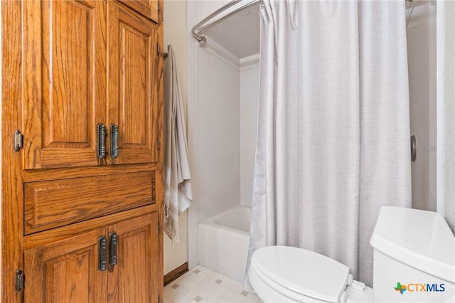 bathroom with shower / bathtub combination with curtain and toilet