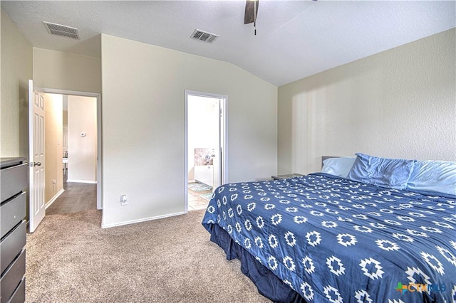 carpeted bedroom featuring lofted ceiling, ceiling fan, and a textured ceiling