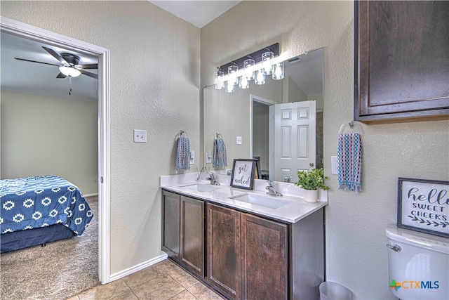 bathroom with vanity, tile patterned floors, toilet, and ceiling fan