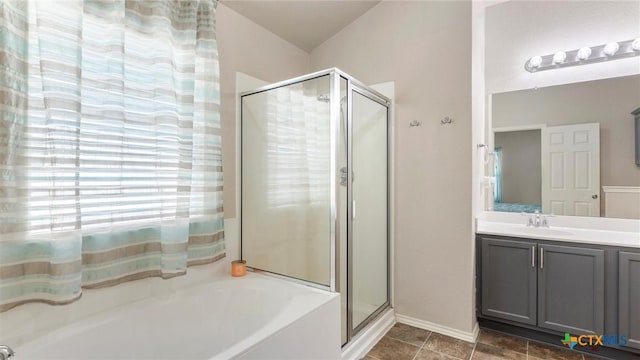 234 Wild Plum, San Marcos, TX 78666 - full bathroom with a bath, a stall shower, vanity, and baseboards