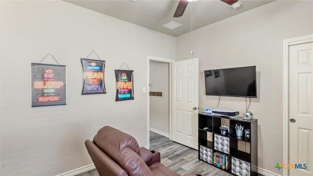 234 Wild Plum, San Marcos, TX 78666 - sitting room featuring ceiling fan, wood finished floors, and baseboards