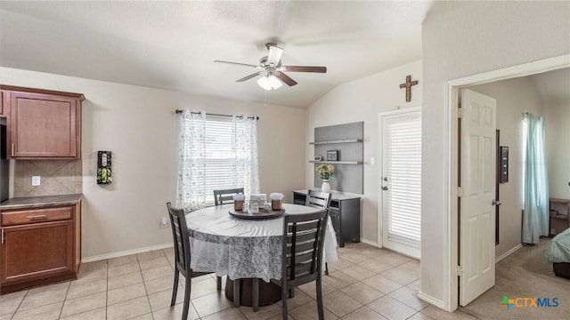 234 Wild Plum, San Marcos, TX 78666 - dining room with a ceiling fan, light tile patterned floors, vaulted ceiling, and baseboards