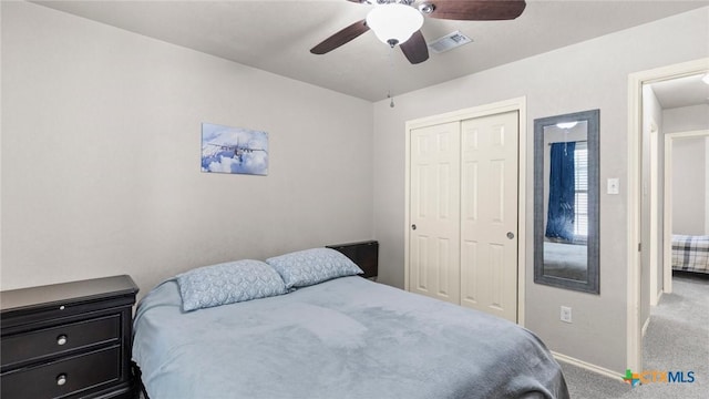 234 Wild Plum, San Marcos, TX 78666 - bedroom with carpet floors, a closet, baseboards, and a ceiling fan