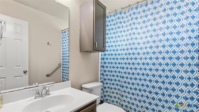234 Wild Plum, San Marcos, TX 78666 - bathroom featuring vanity, toilet, a shower with shower curtain, and a textured wall