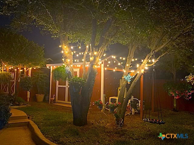 view of yard at night