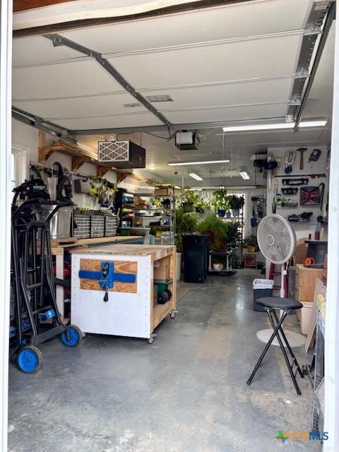 garage with a workshop area