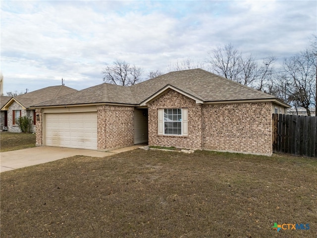 single story home with a garage and a front yard