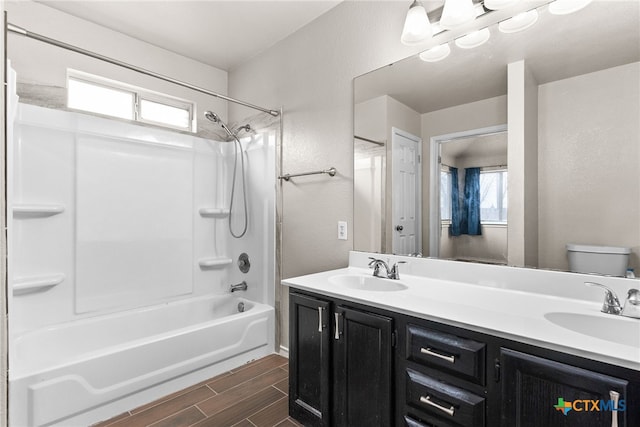 full bathroom featuring shower / tub combination, vanity, and toilet