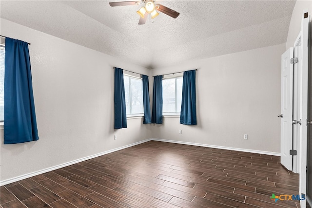 unfurnished room featuring ceiling fan and a textured ceiling