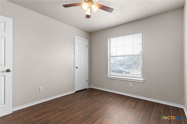 unfurnished room featuring plenty of natural light, ceiling fan, and a textured ceiling