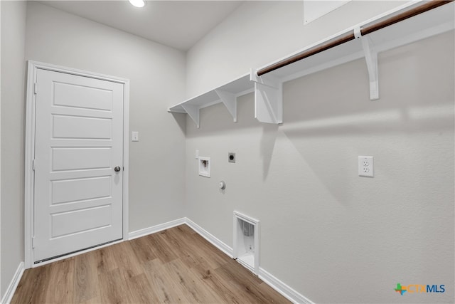 laundry area featuring gas dryer hookup, washer hookup, hookup for an electric dryer, and light wood-type flooring