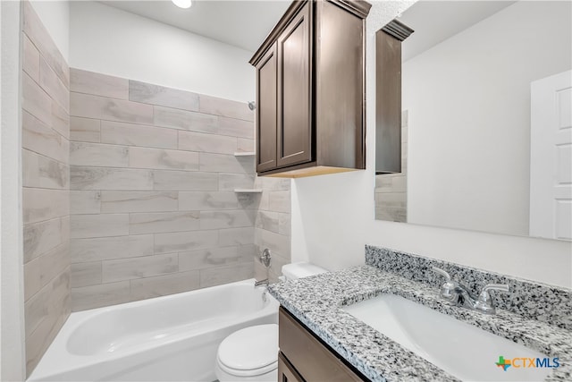 full bathroom with vanity, toilet, and tiled shower / bath combo