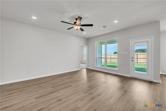 unfurnished room with light hardwood / wood-style floors and ceiling fan