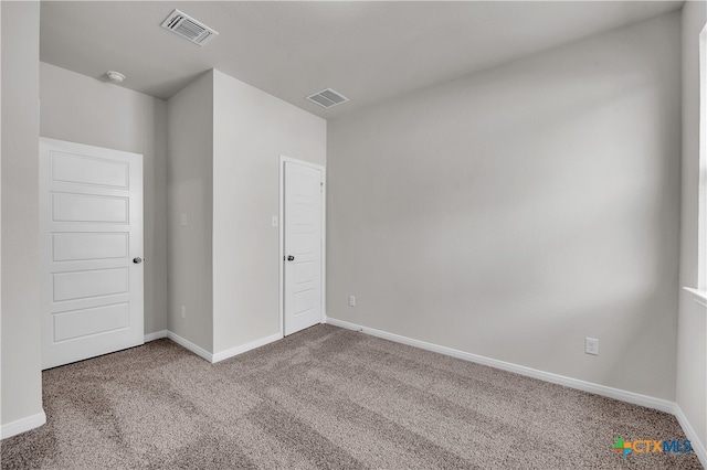 empty room with carpet flooring