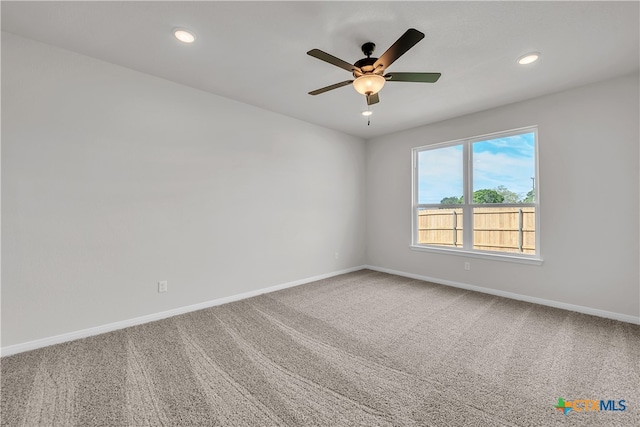 carpeted empty room with ceiling fan