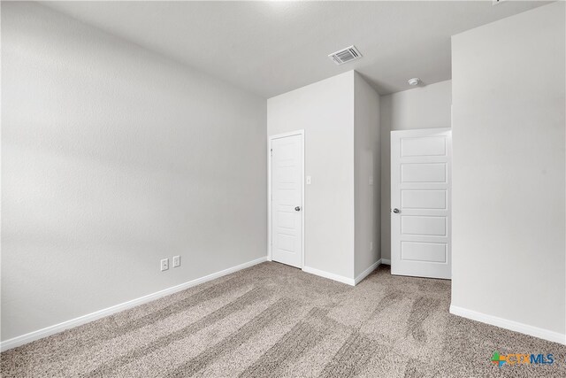 unfurnished bedroom with carpet floors