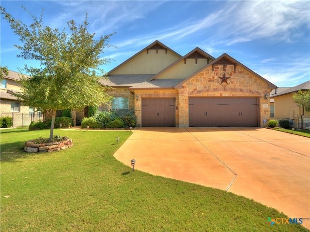 view of front of home featuring a garage and a front yard