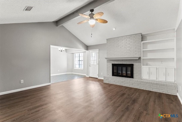 12103 Wycliff Ln, Austin, TX 78727 - unfurnished living room with a ceiling fan, wood finished floors, a textured ceiling, and a brick fireplace