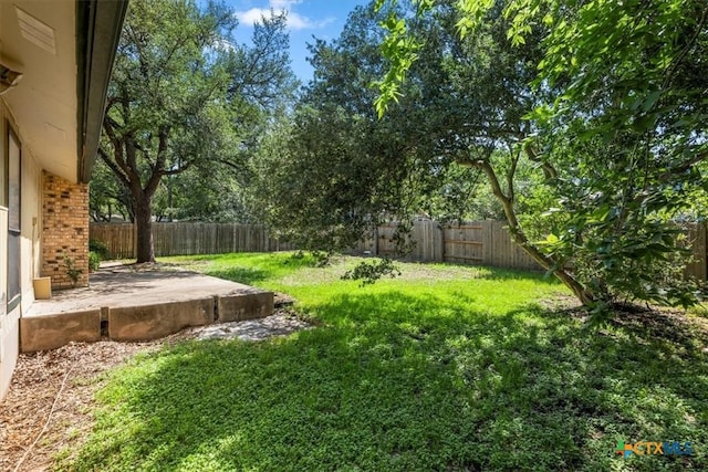 12103 Wycliff Ln, Austin, TX 78727 - fenced backyard featuring a patio